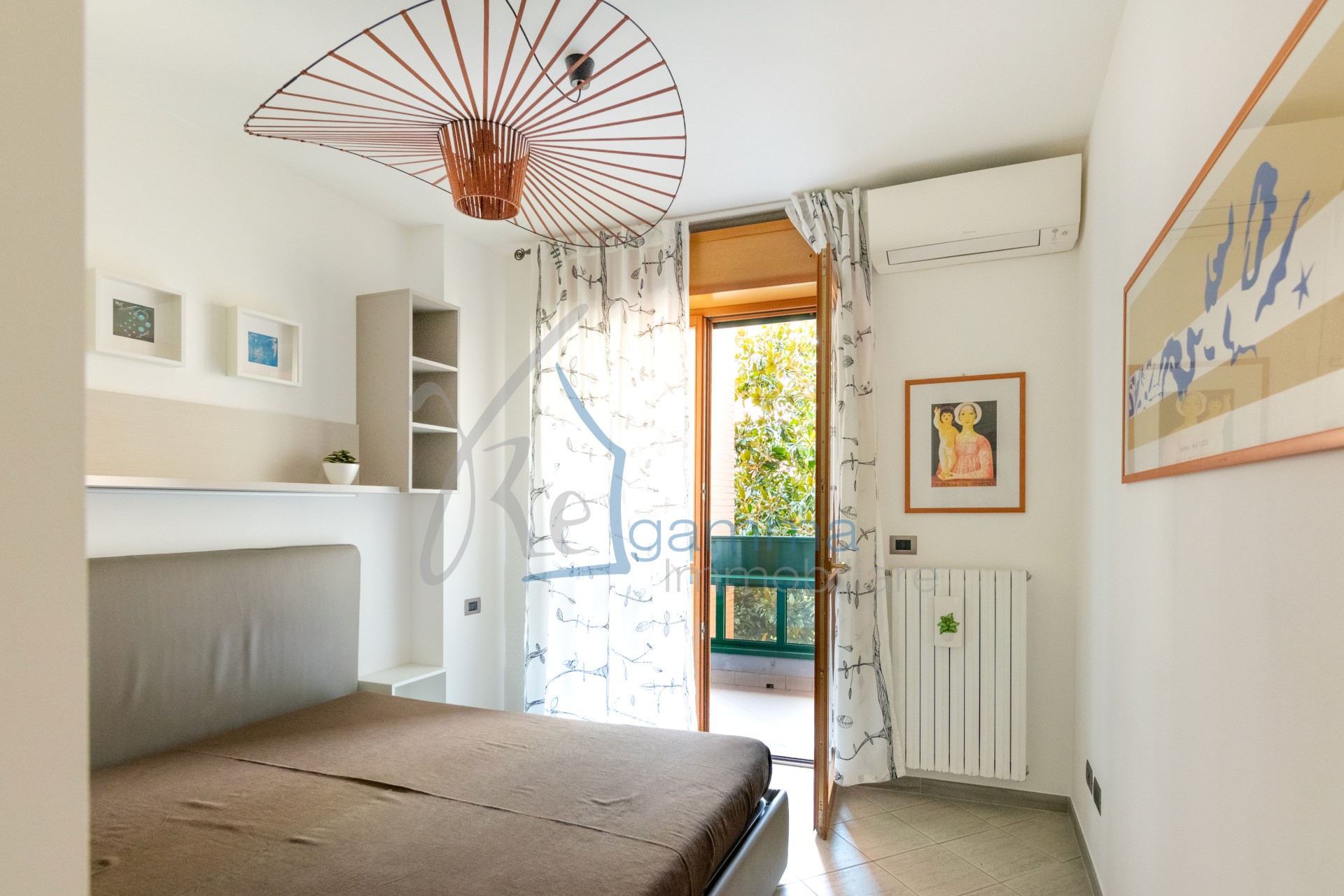camera_da_letto_bilocale_locazione_via_avezzana_regamma_immobiliare